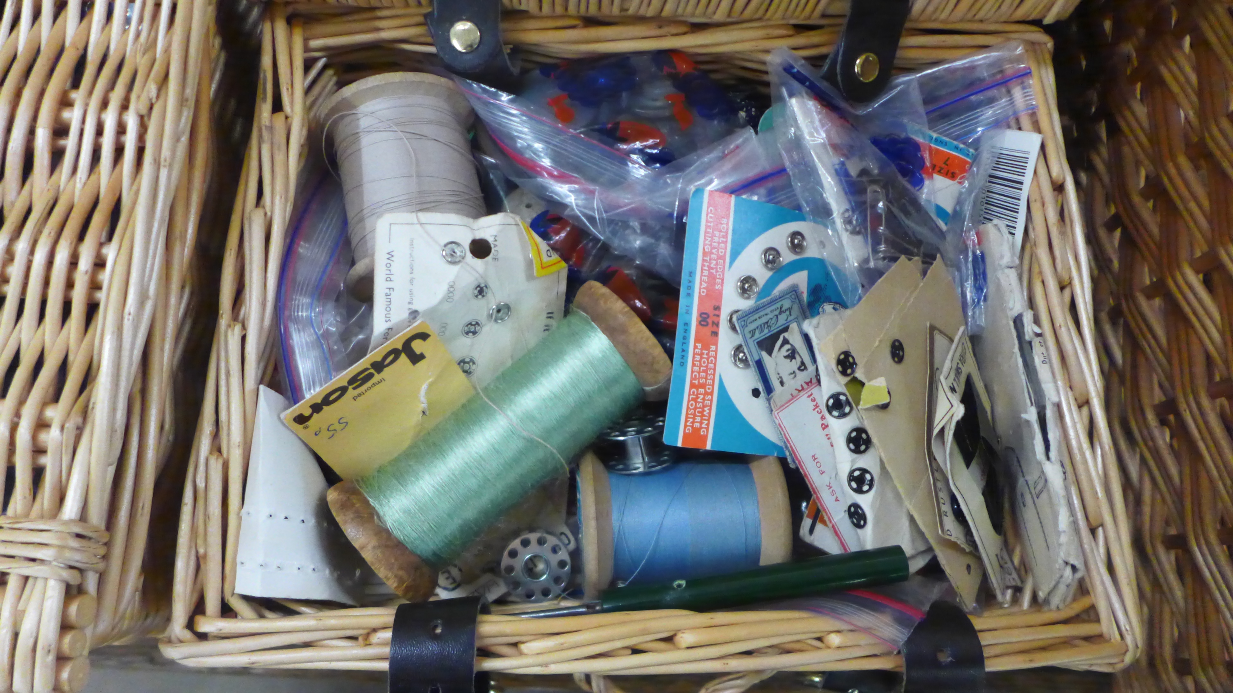 Four wicker baskets, one containing linen, one trims, lace and crochet edge, one haberdashery and - Image 4 of 4