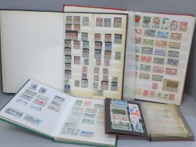 A box file of World stamps in 4 albums