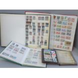 A box file of World stamps in 4 albums