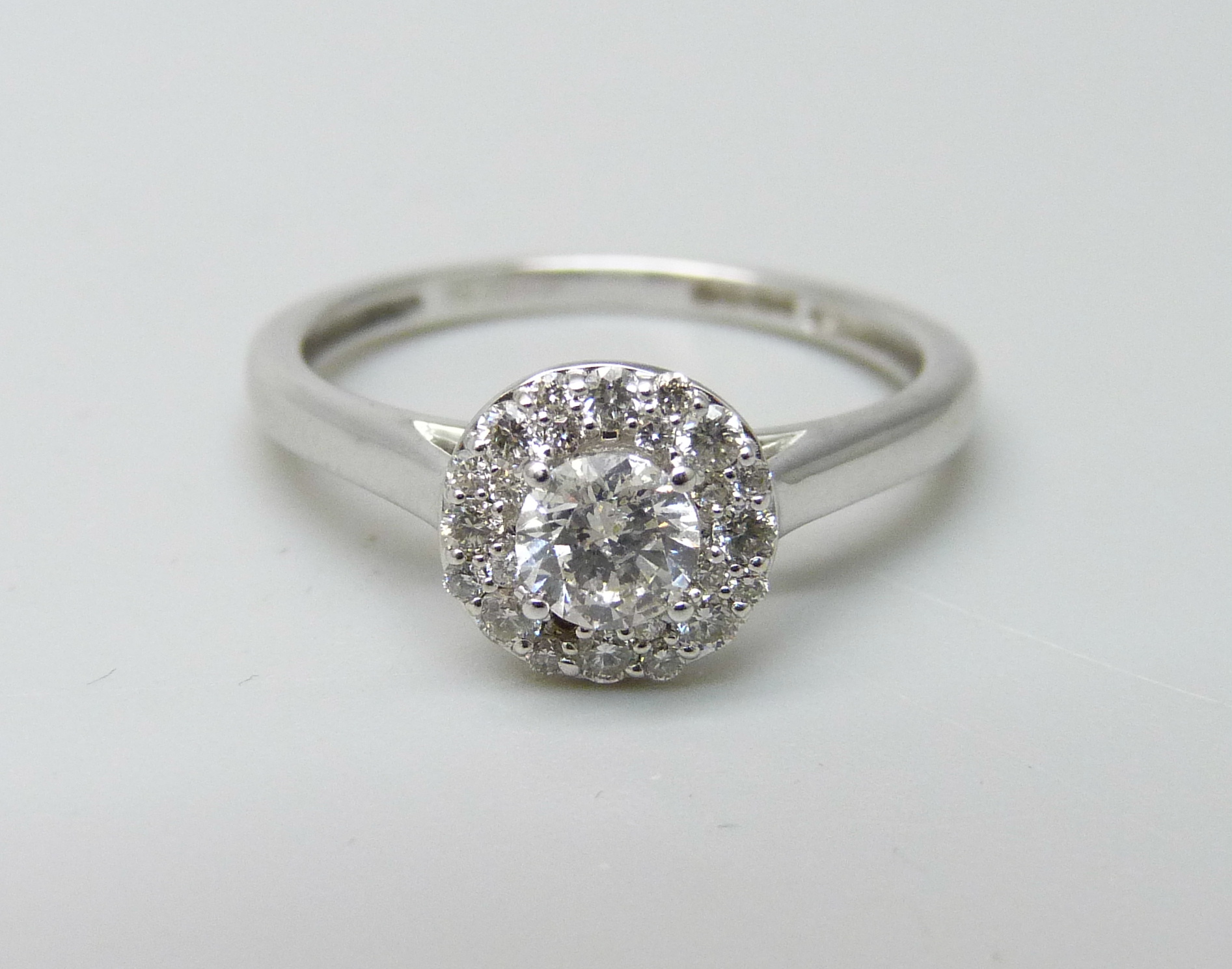 An 18ct white gold and diamond ring, 0.5ct total diamond weight marked on the shank, 2.7g, M,