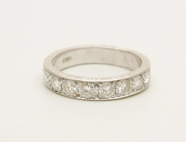 An 18ct white gold and nine diamond 1/2 eternity ring, approximately 1.40ct diamond weight, 7.1g, T