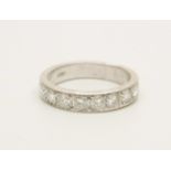 An 18ct white gold and nine diamond 1/2 eternity ring, approximately 1.40ct diamond weight, 7.1g, T