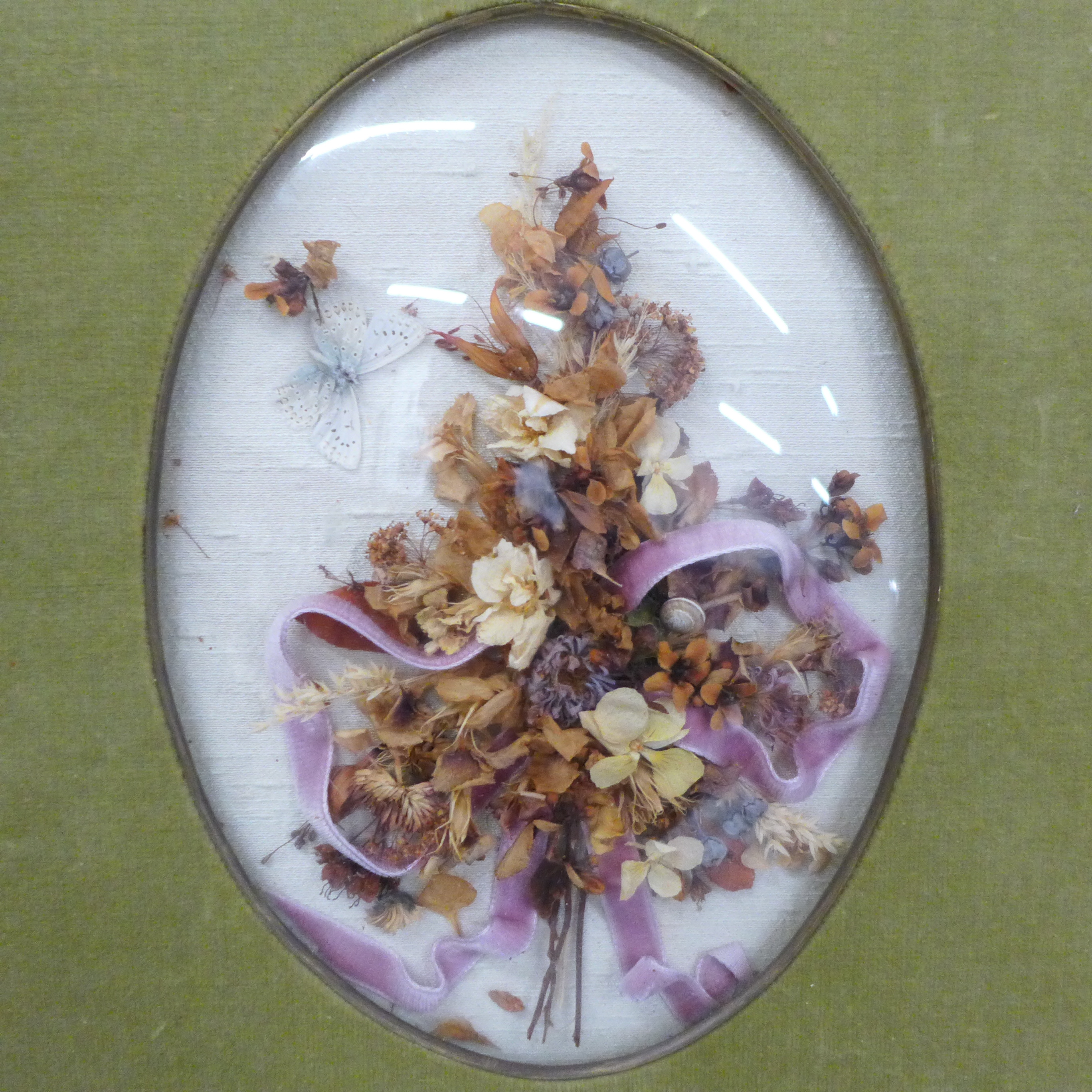 An Edwardian dried flower display under a convex glass with silk photograph frame and a double - Image 3 of 3