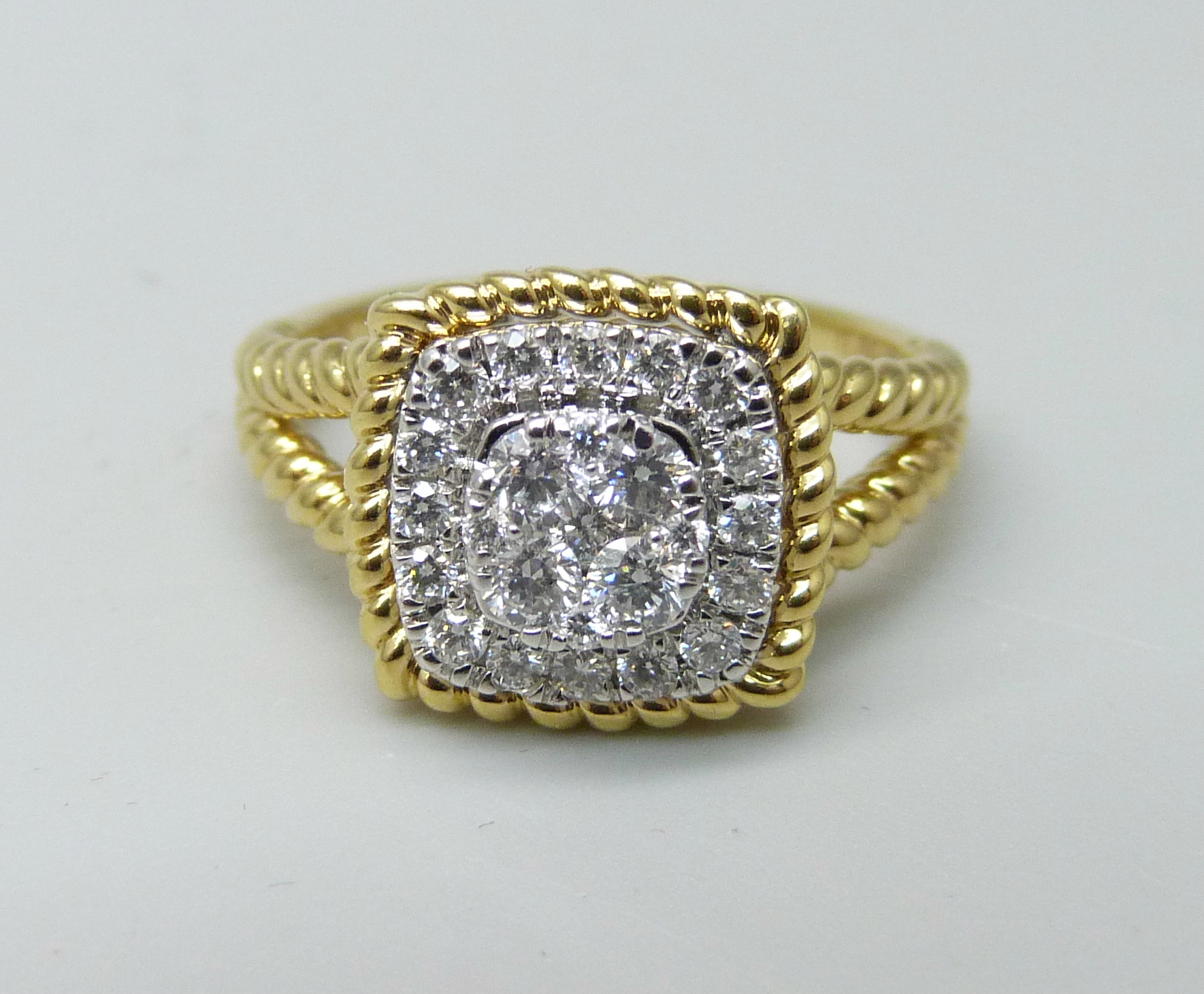 An 18ct gold and diamond cluster ring, 0.5ct weight marked in the shank, 5g, M