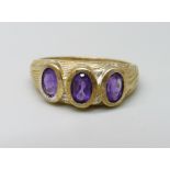 A silver gilt and amethyst trilogy ring, P