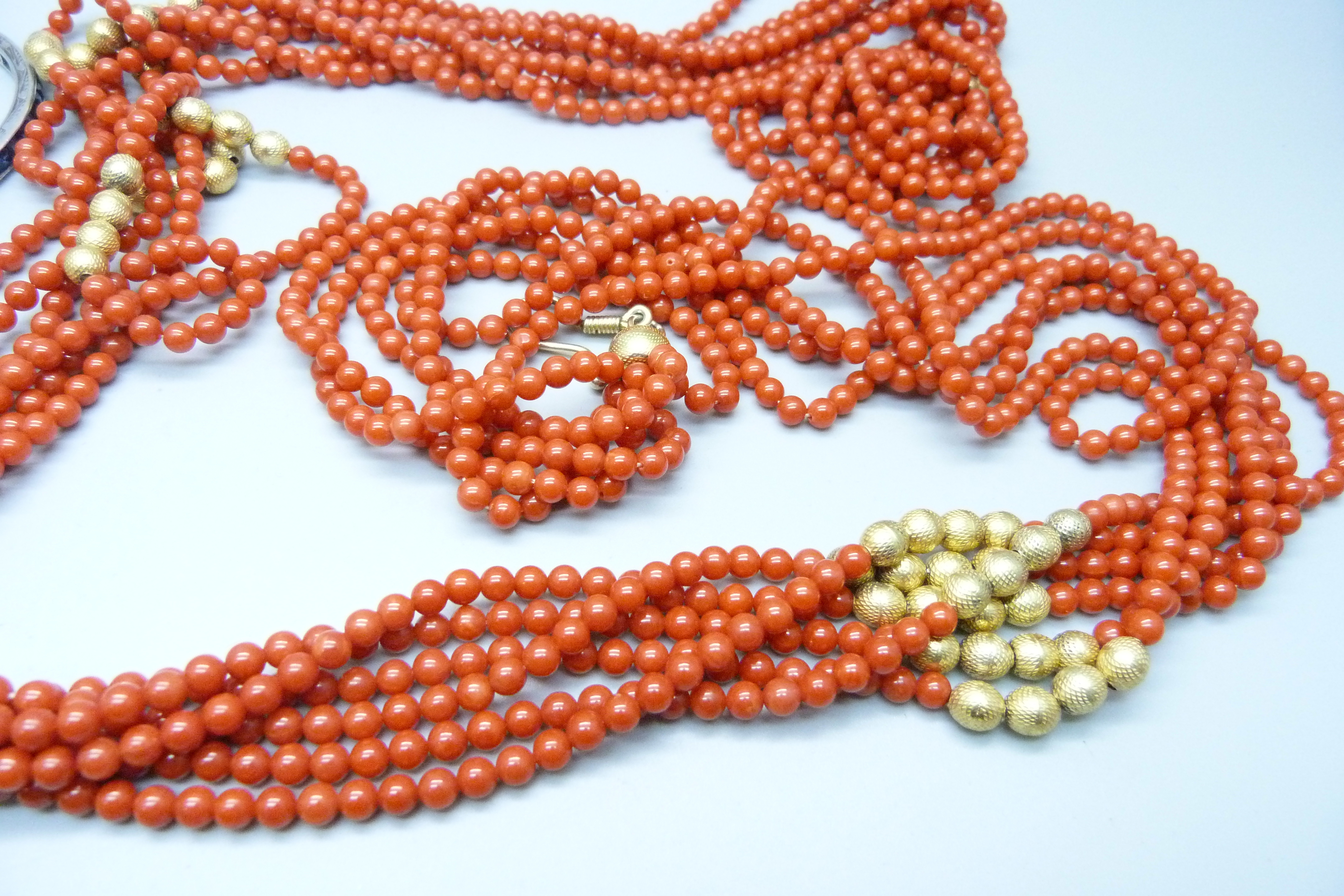 A vintage silver gilt and faux coral necklace, approximately 107cm, and two white metal and stone - Image 3 of 3