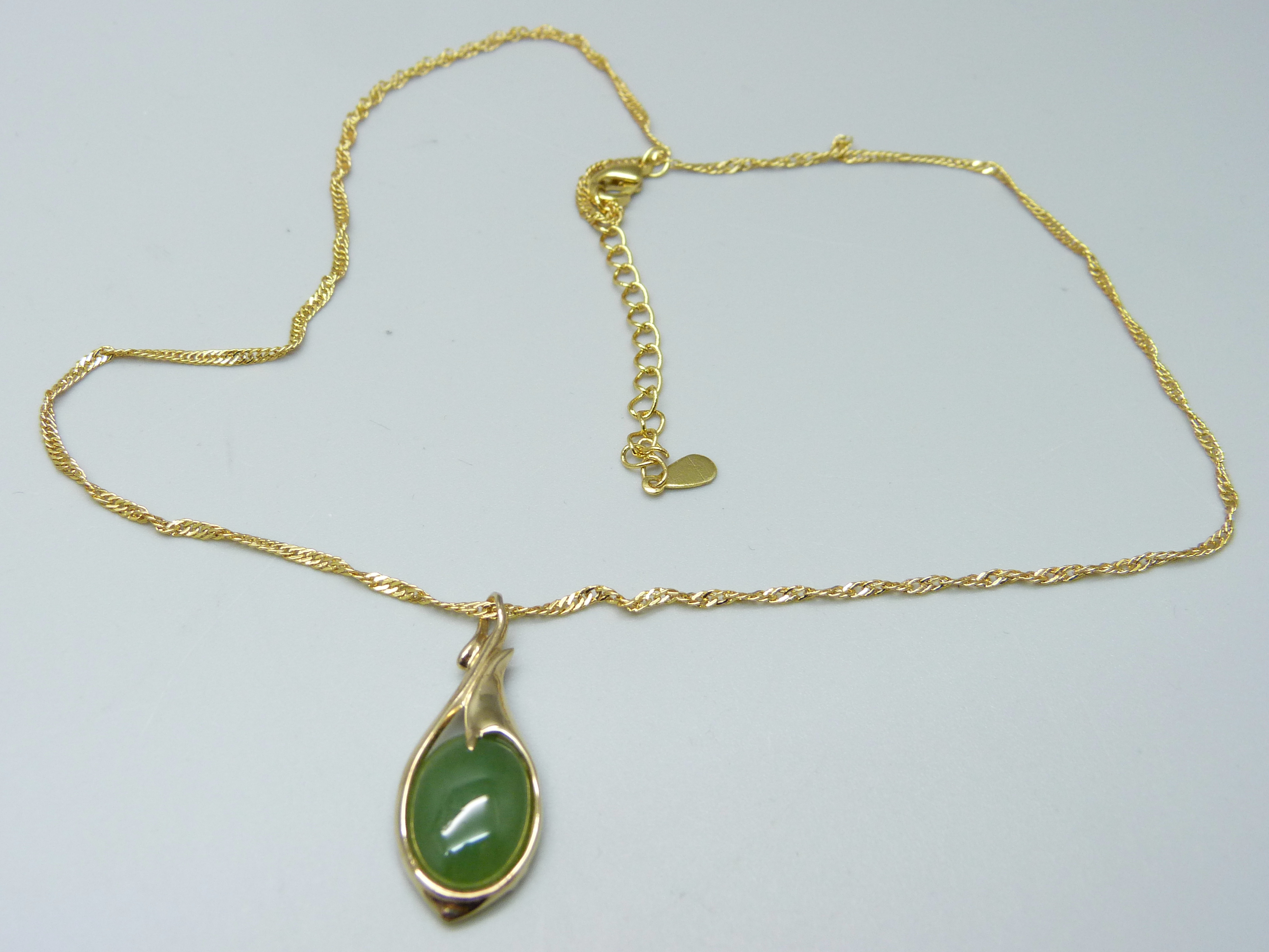 A silver gilt chalcedony set Art Nouveau style pendant on a chain