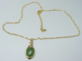 A silver gilt chalcedony set Art Nouveau style pendant on a chain