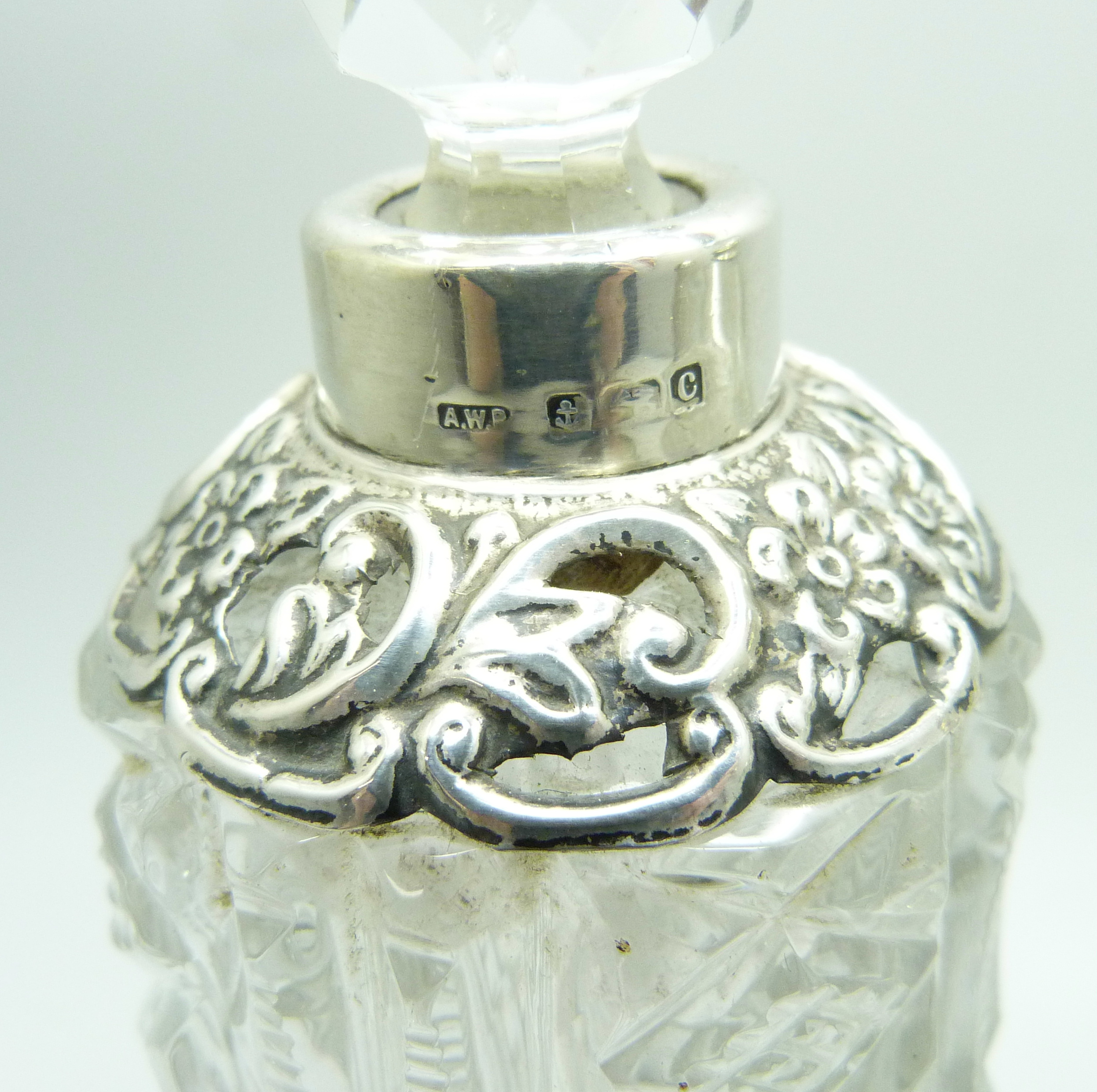 A silver mounted cut glass scent bottle in the shape of a bell, Birmingham 1902, two other silver - Image 3 of 3