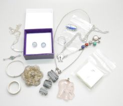 A collection of silver jewellery including a filigree brooch, child's bangle, rings, etc. and a pair