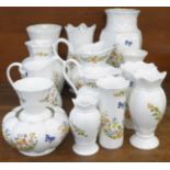 A collection of fourteen Aynsley Cottage Garden vases and jugs