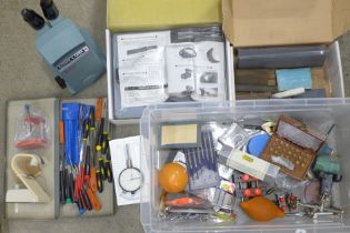 A large collection of watchmakers tools including a Bausch & Lomb microscope