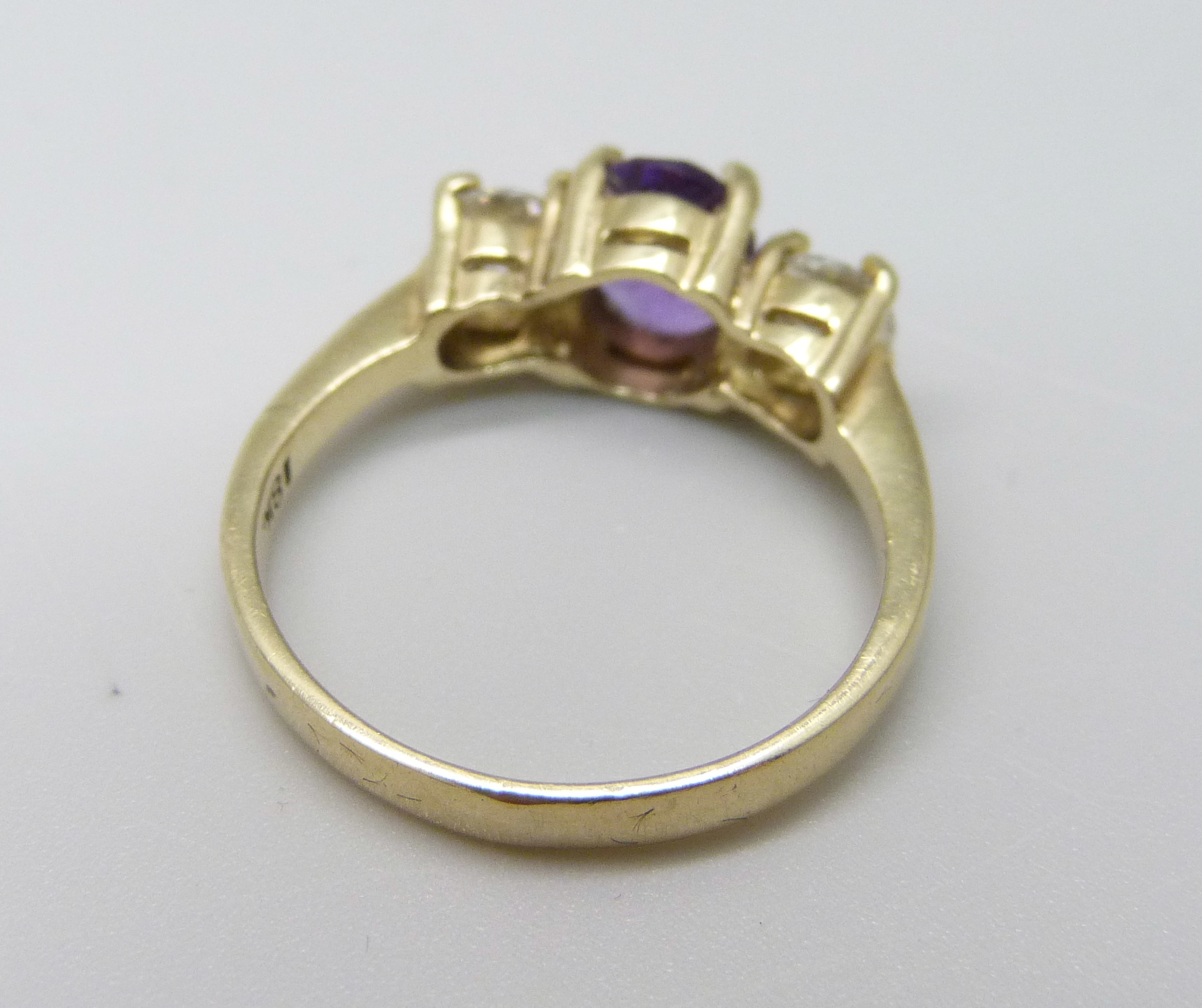 An 18ct gold, amethyst and diamond three stone ring, approximately 90ct weight, 3.9g, Q - Image 3 of 3