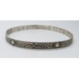 A 925 silver Celtic design bangle, stamped 'T'