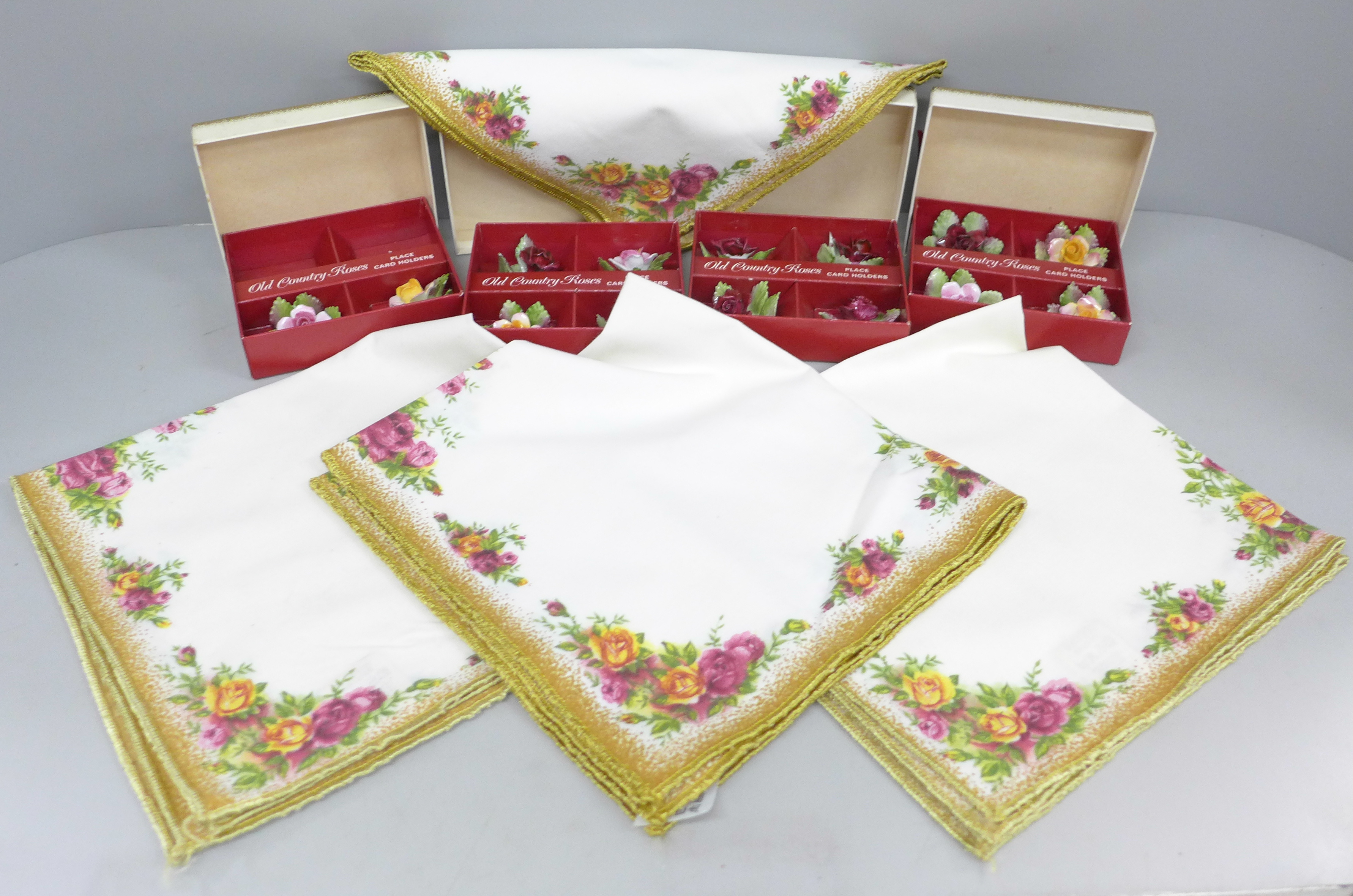 Four sets of 4 Royal Albert Old Country Roses place holders and a set of four napkins