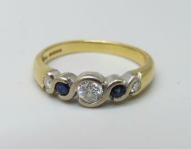 An 18ct gold diamond and sapphire ring, 3.7g, M