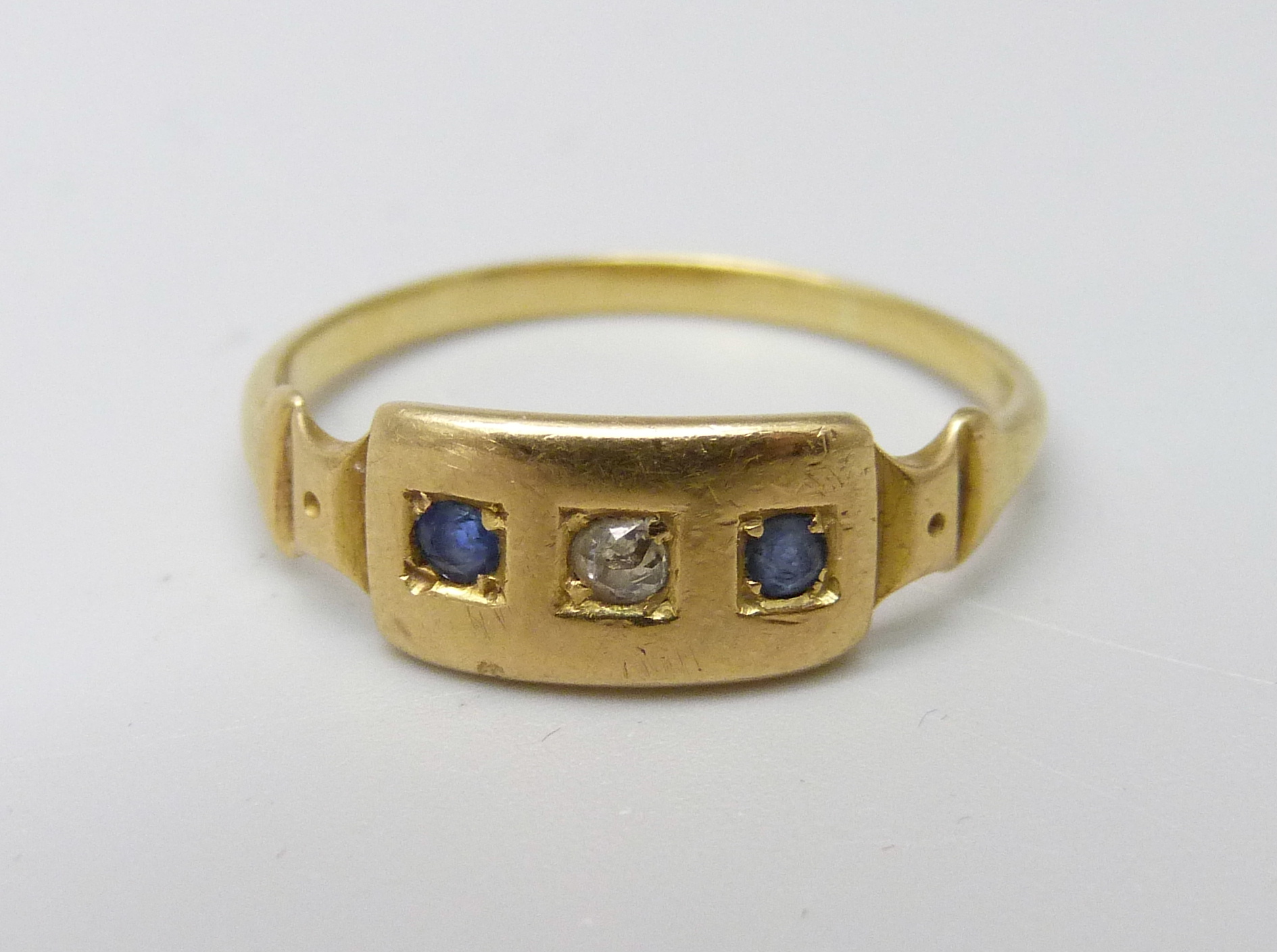 A yellow metal diamond and sapphire ring, 2.5g, M/N