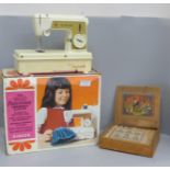 A Little Golden Panoramic sewing machine by Singer and a block building set