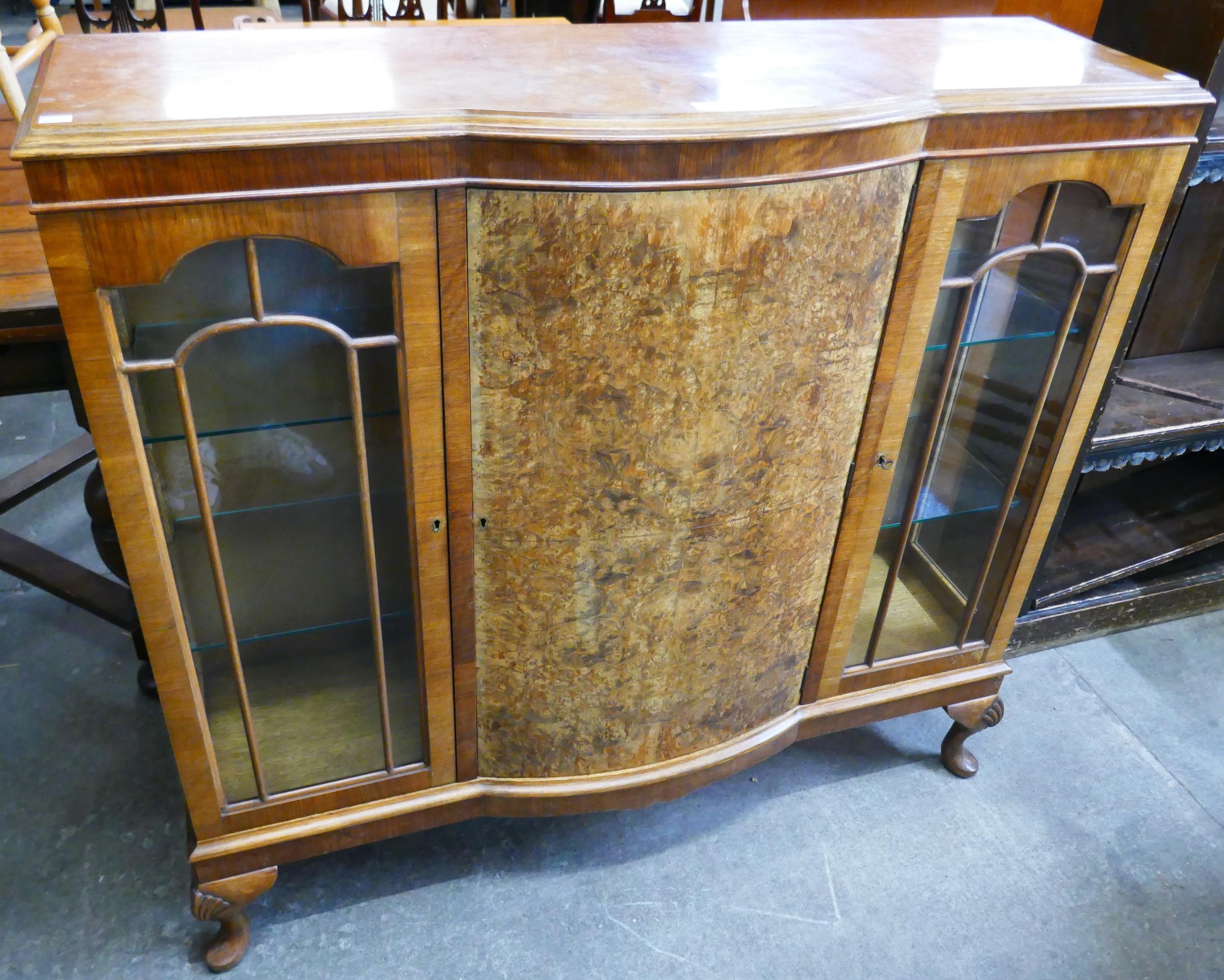 A Queen Anne style burr walnut breakfront side cabinet