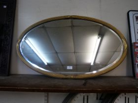 A Victorian oval gilt framed mirror