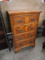 A small George III style yew wood chest of drawers
