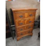 A small George III style yew wood chest of drawers