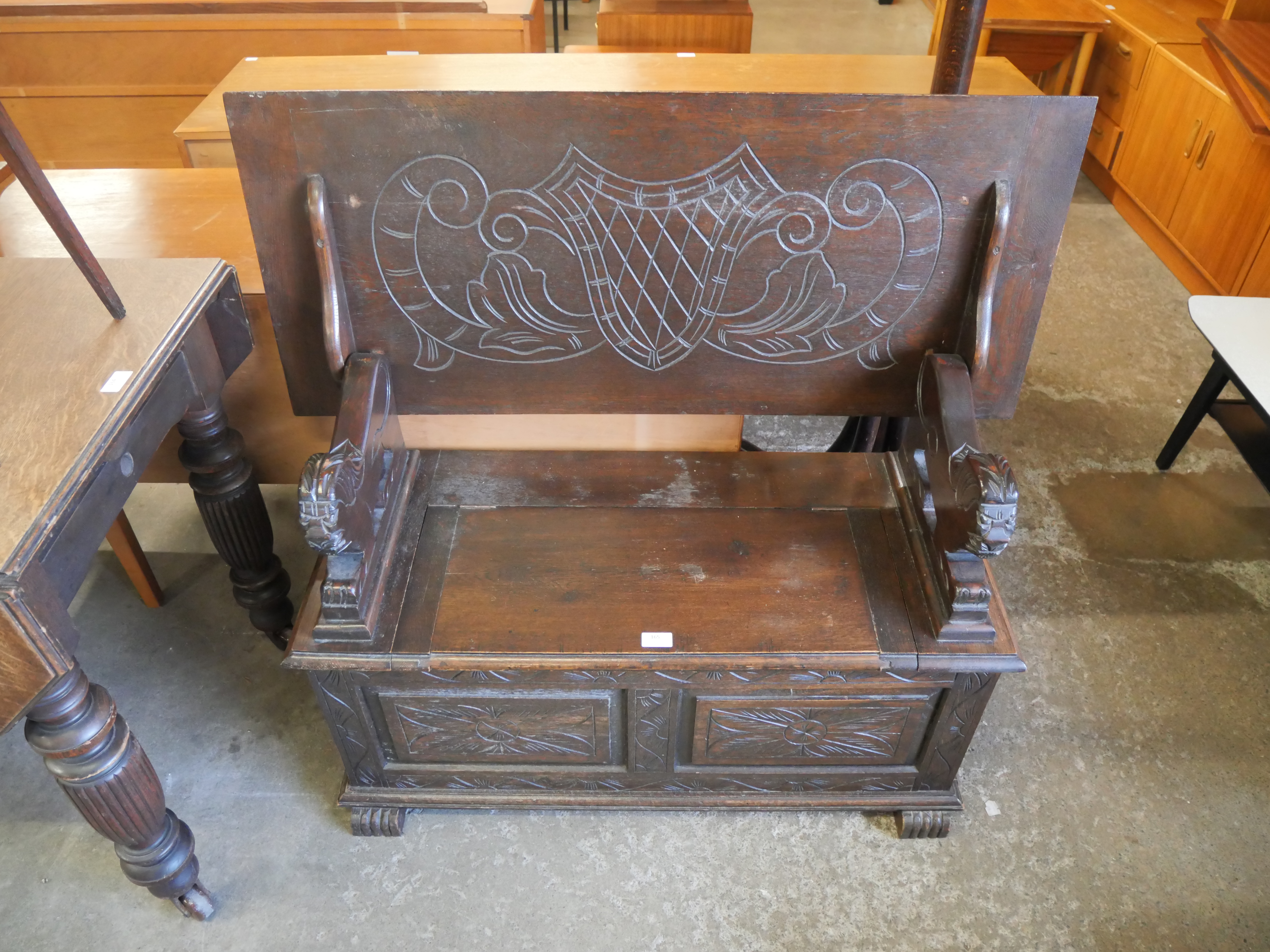 A carved oak monk's bench - Image 2 of 3