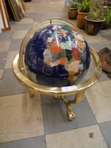 A brass and faux gemstone inlaid terrestrial globe