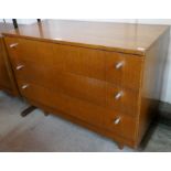 A teak chest of drawers