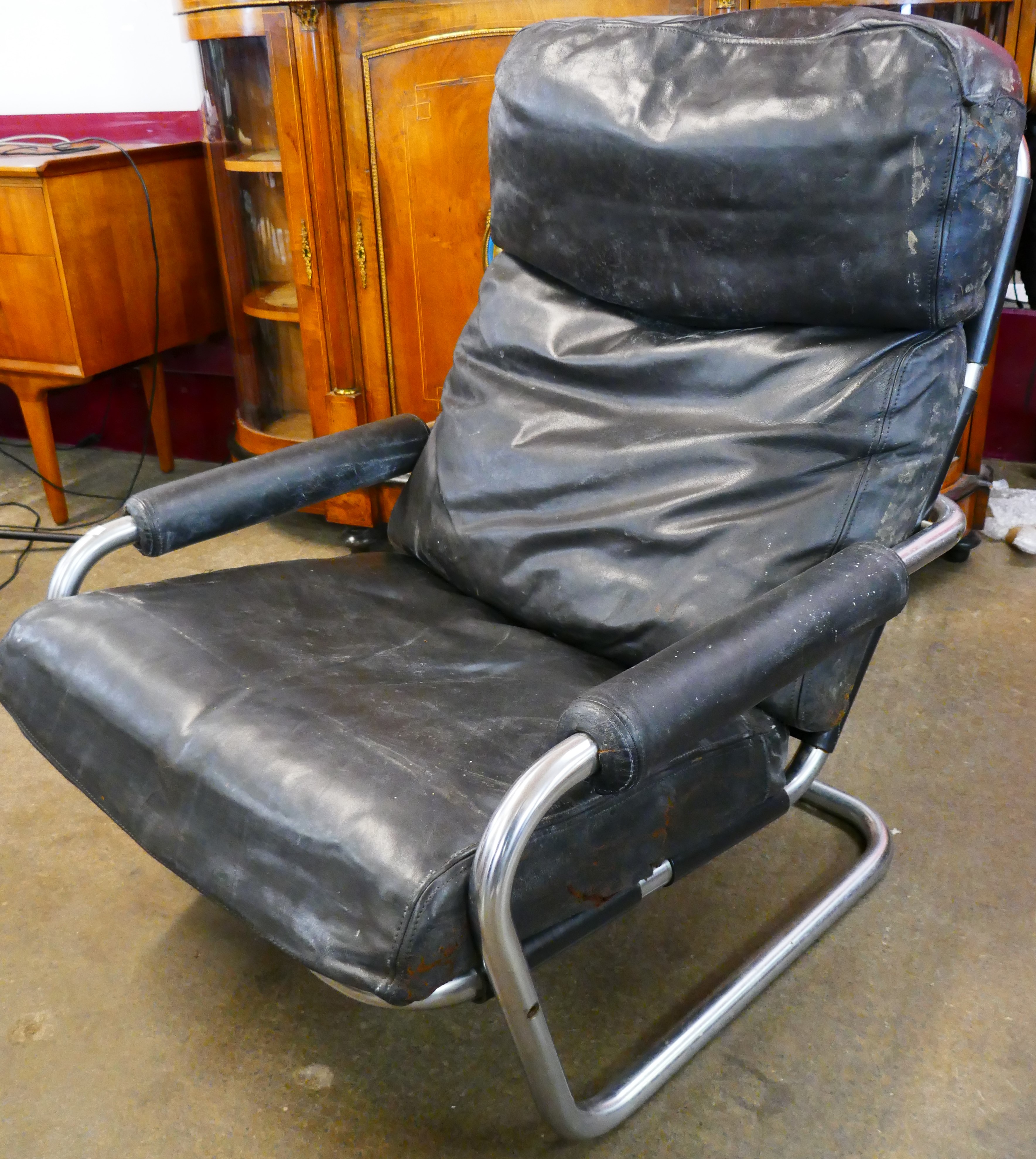 A Dutch Gelderland chrome and black leather lounge chair, designed by Jan de Bowne