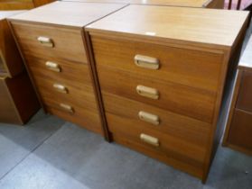 A pair of teak chests of drawers