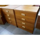 A pair of teak chests of drawers