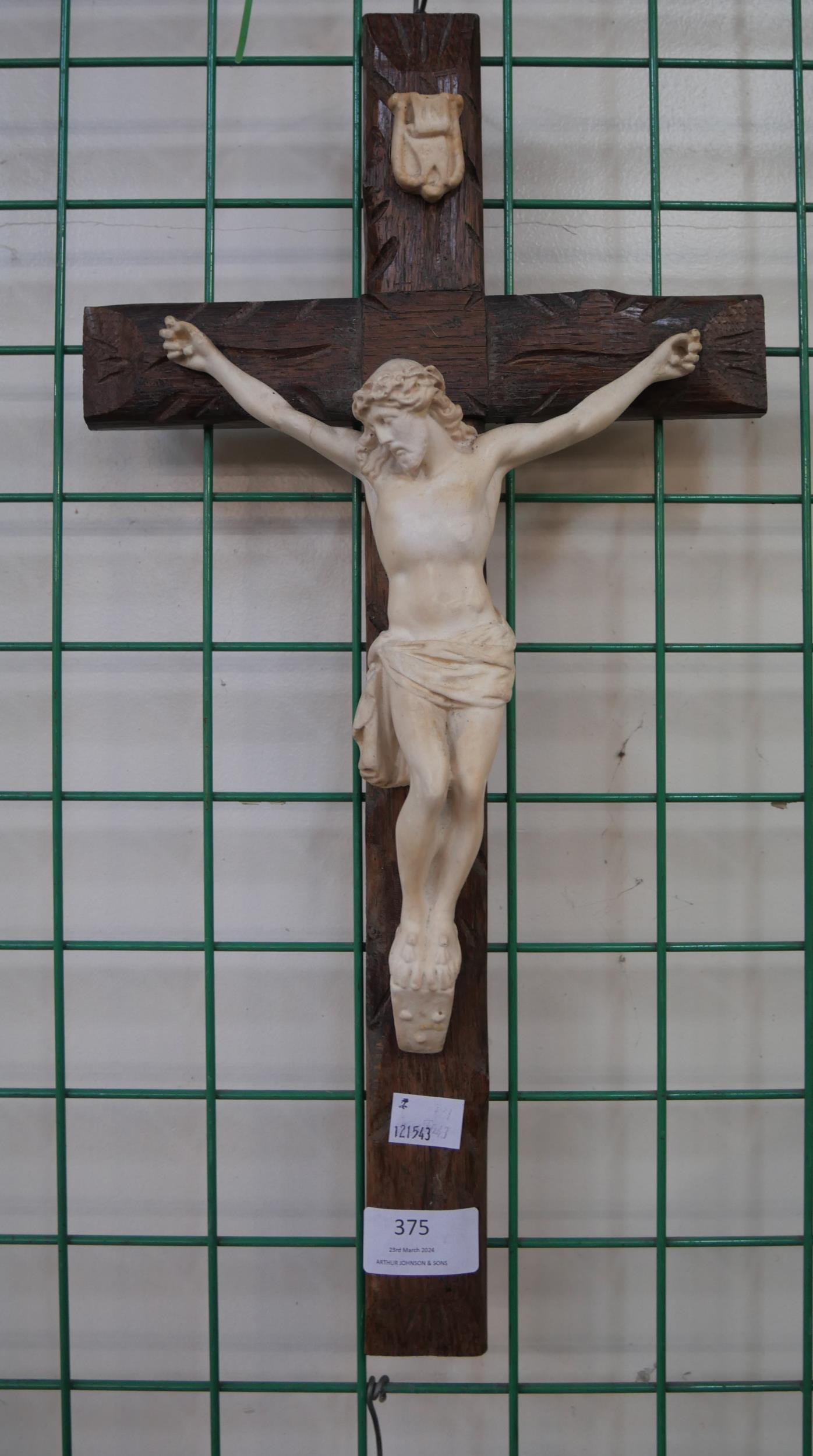 A French wooden and faux ivory crucifix