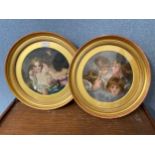 A pair of early 20th Century circular prints of children, framed