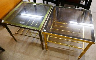 A pair of square glass top coffee tables