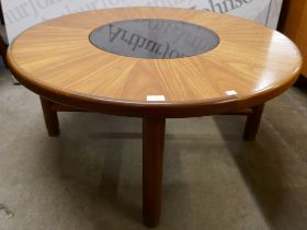 A G-Plan teak and glass topped circular coffee table