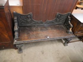 A Victorian carved oak hallseat