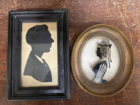 A silhouette on glass, portrait of a lady and one other