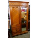 A Victorian Aesthetic Movement pine wardrobe