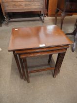 An inlaid nest of tables and a tilt top occasional table