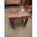 An inlaid nest of tables and a tilt top occasional table