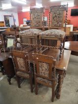 An early 20th Century French oak barleytwist dining table and four chairs