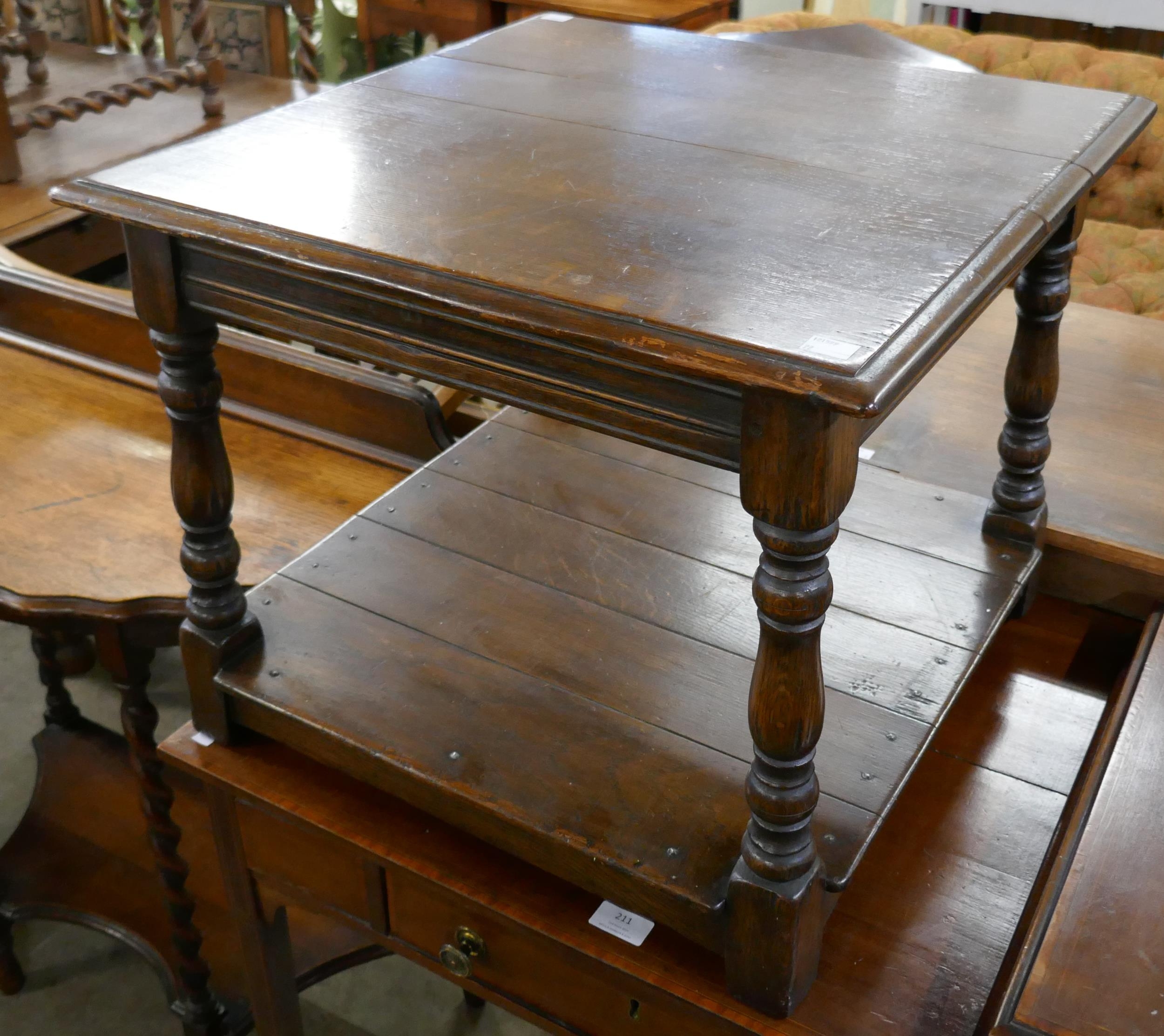 An 18th Century style Ipswich oak two tier lamp table