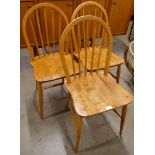A set of three Ercol Blonde elm and beech Windsor chairs
