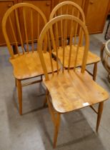 A set of three Ercol Blonde elm and beech Windsor chairs