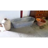 A galvanised tin bath and two large terracotta pots