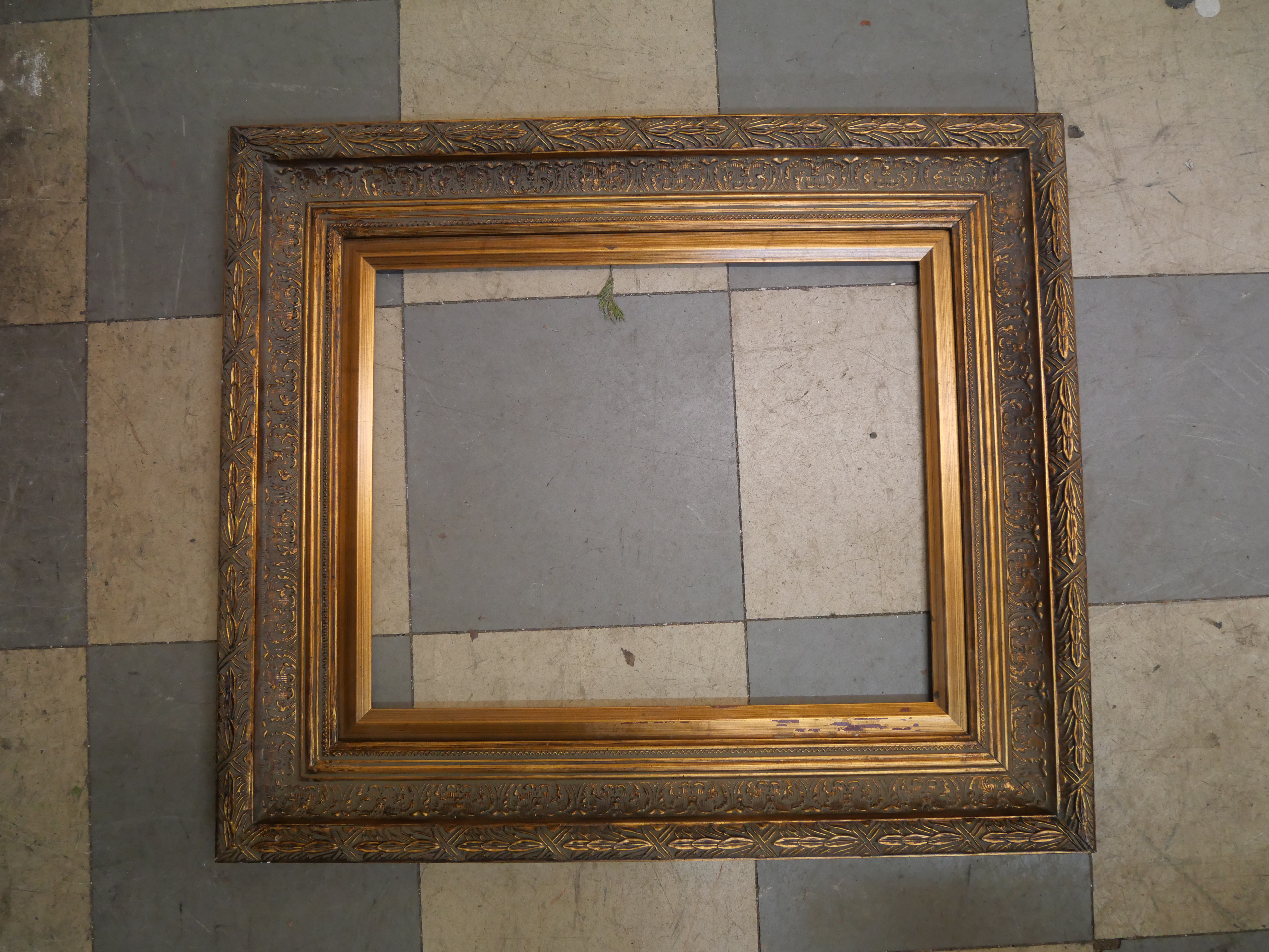 A rectangular gilt frame