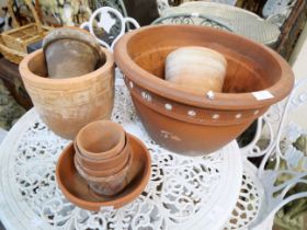 Assorted terracotta garden plant pots