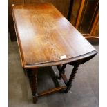 An oak gateleg table