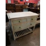 A painted pine four drawer work table